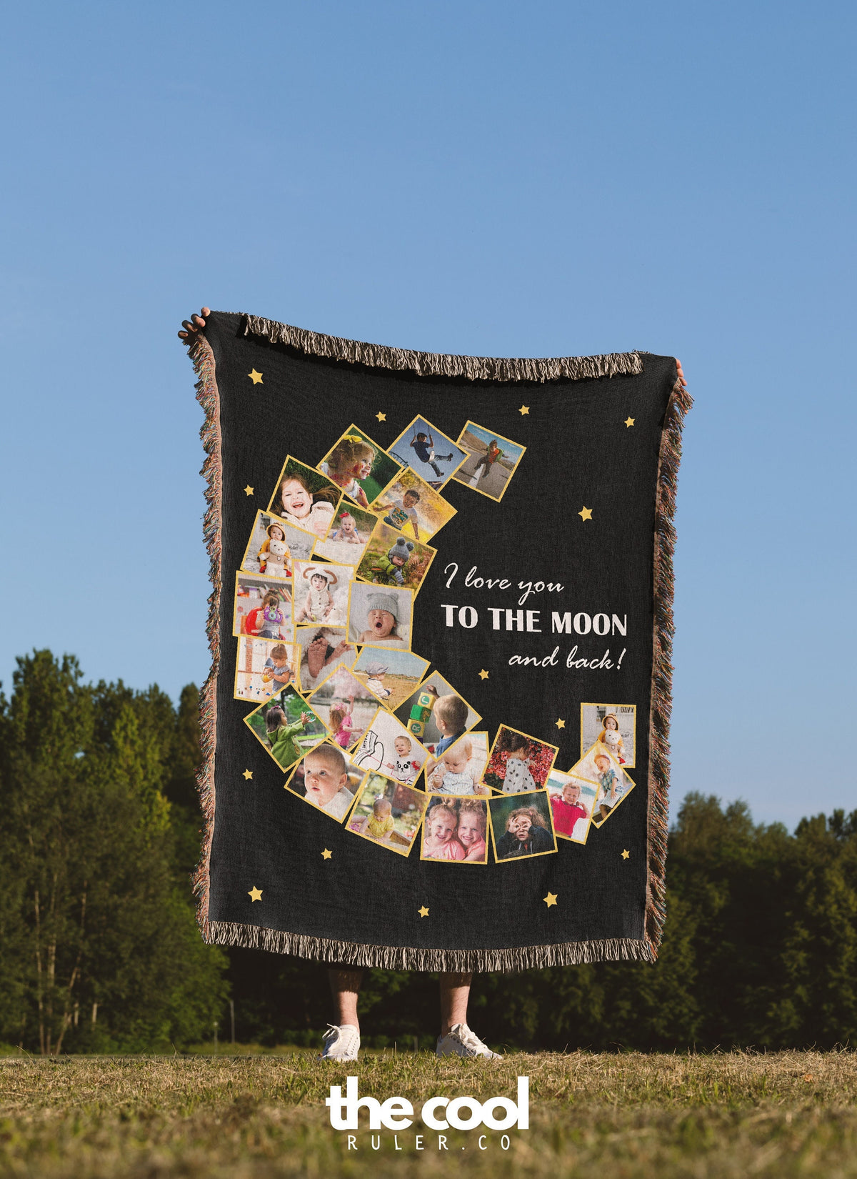 a woman holding a blanket with pictures of people on it