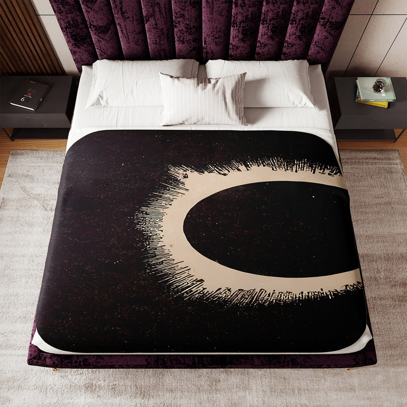 a bed with a black and white design on it