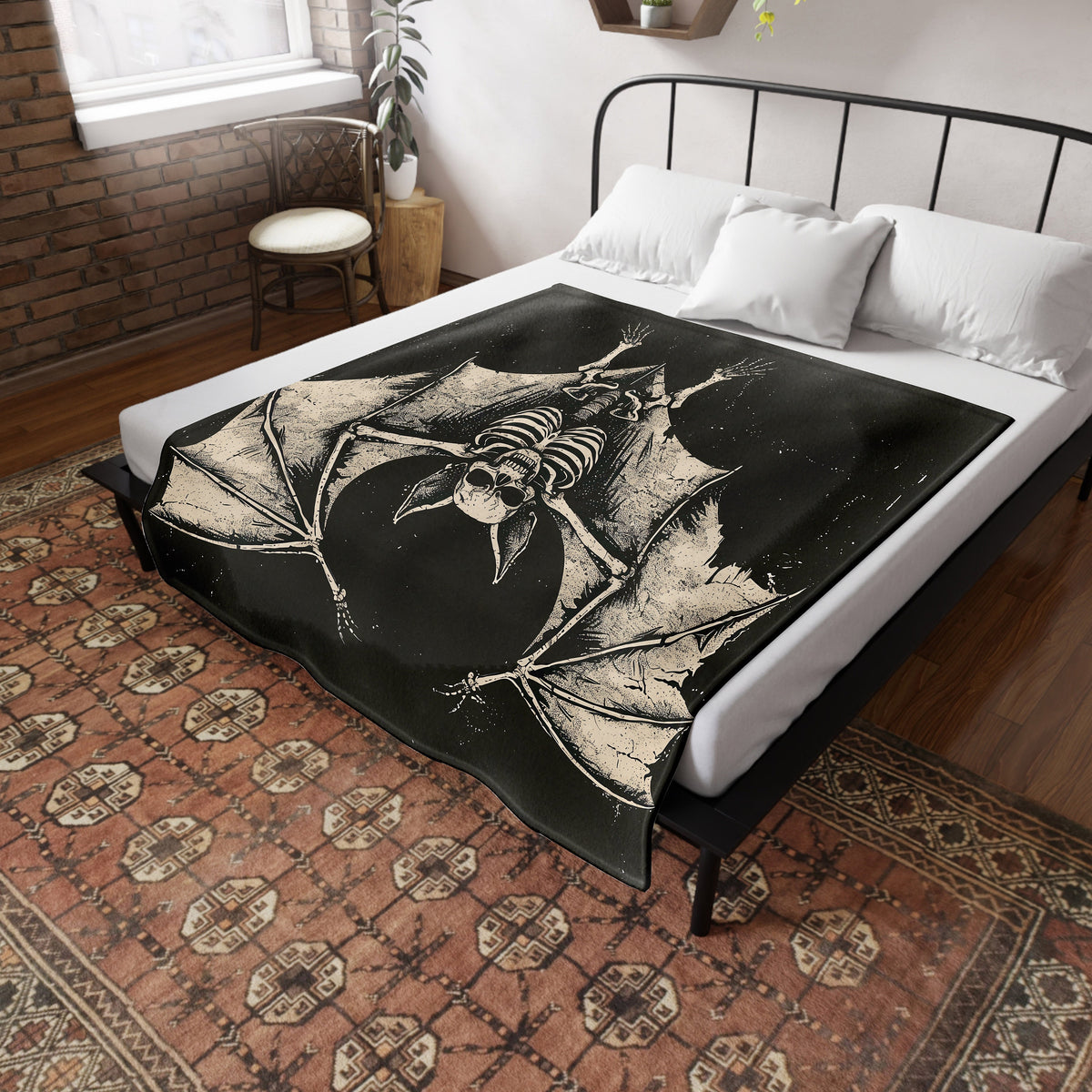 a bed with a black and white picture of a bat on it
