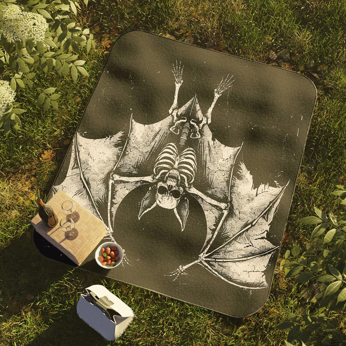 a picture of a bat on a blanket on the ground