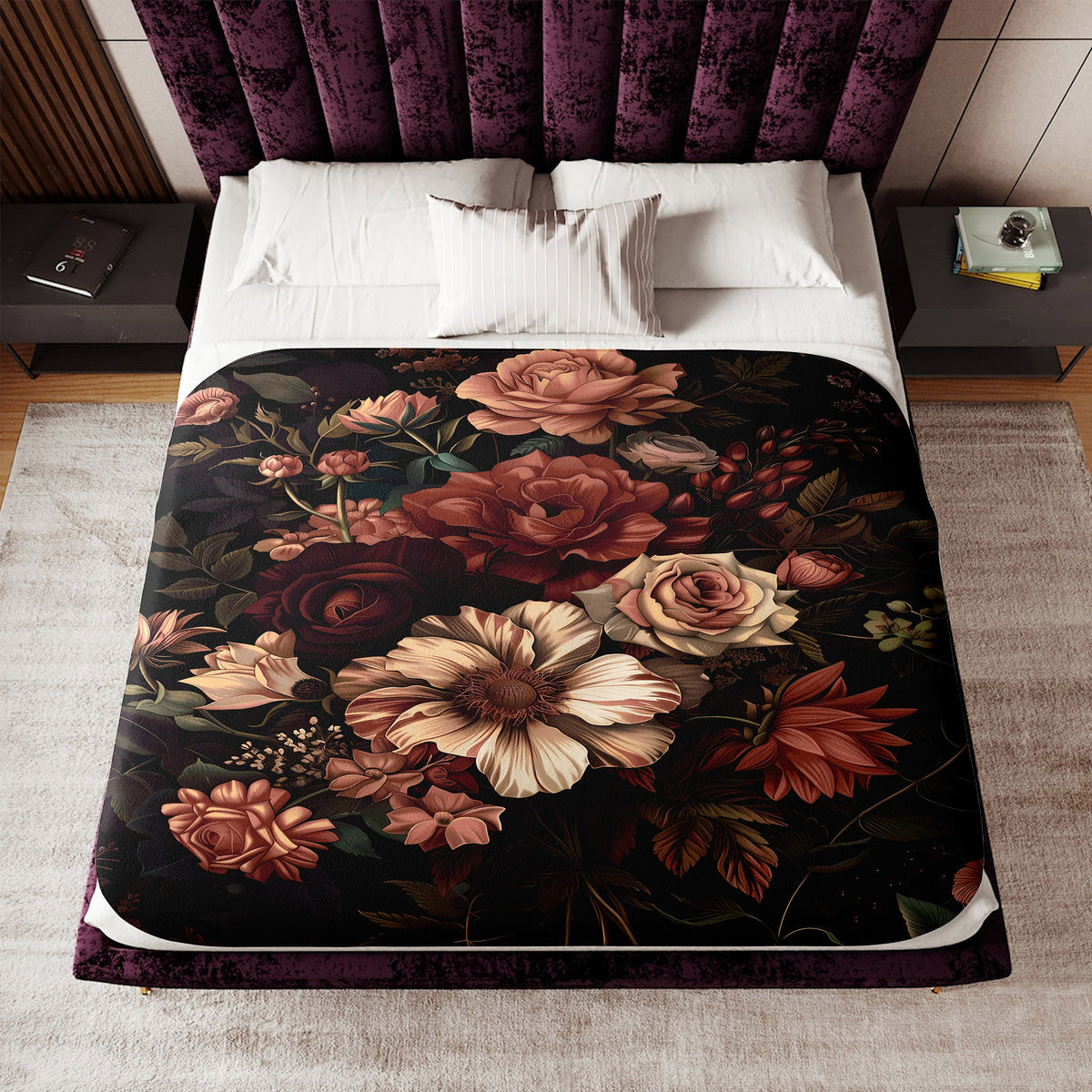 a bed with a floral comforter on top of it