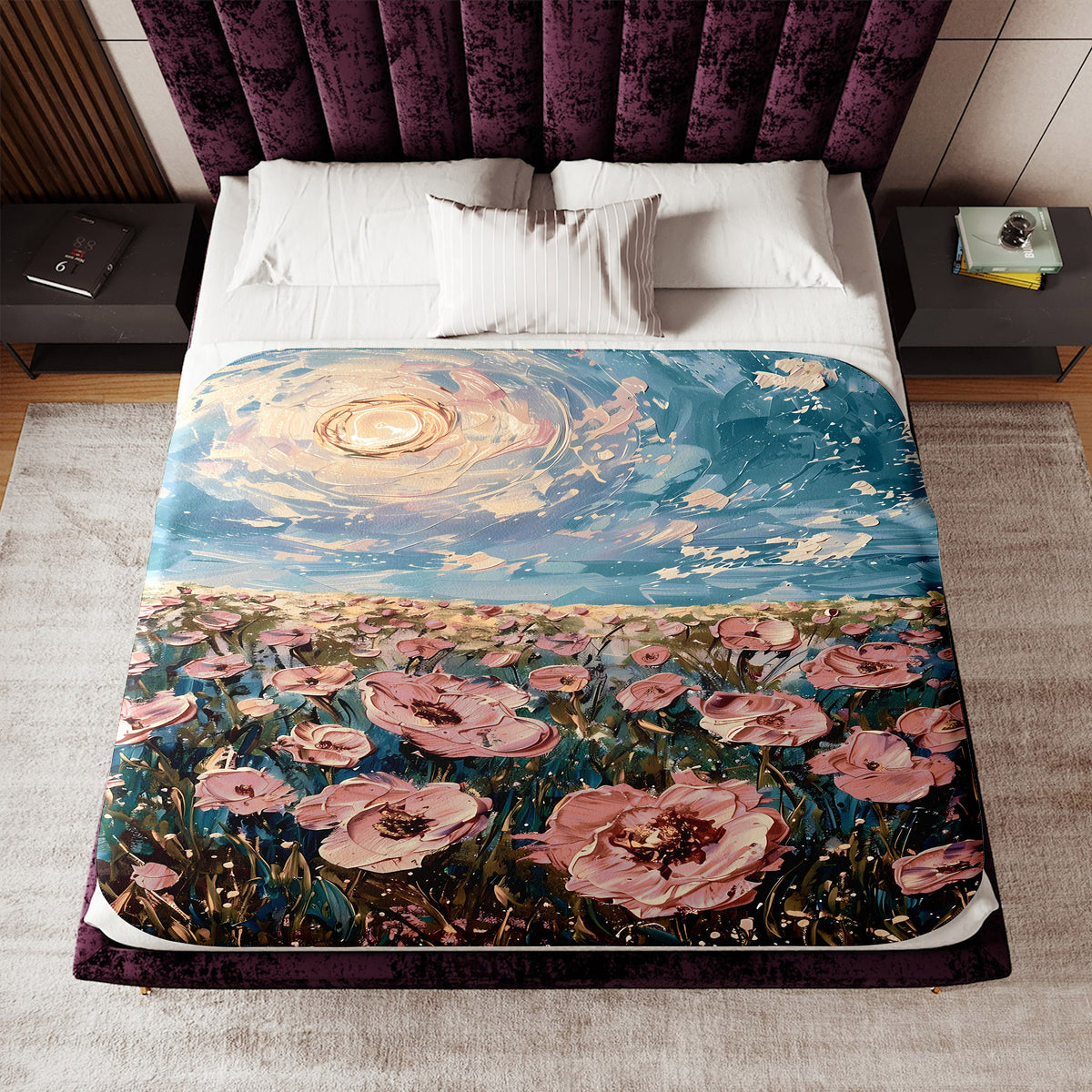 a bed covered in a blanket with a painting on it