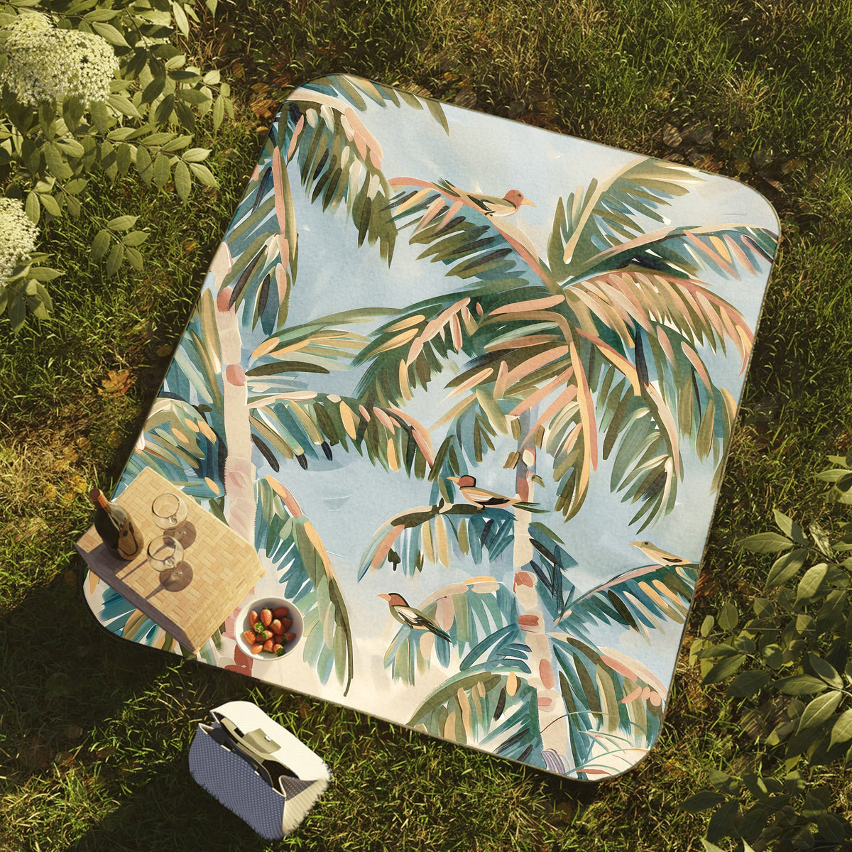 a blanket with a painting of a palm tree on it