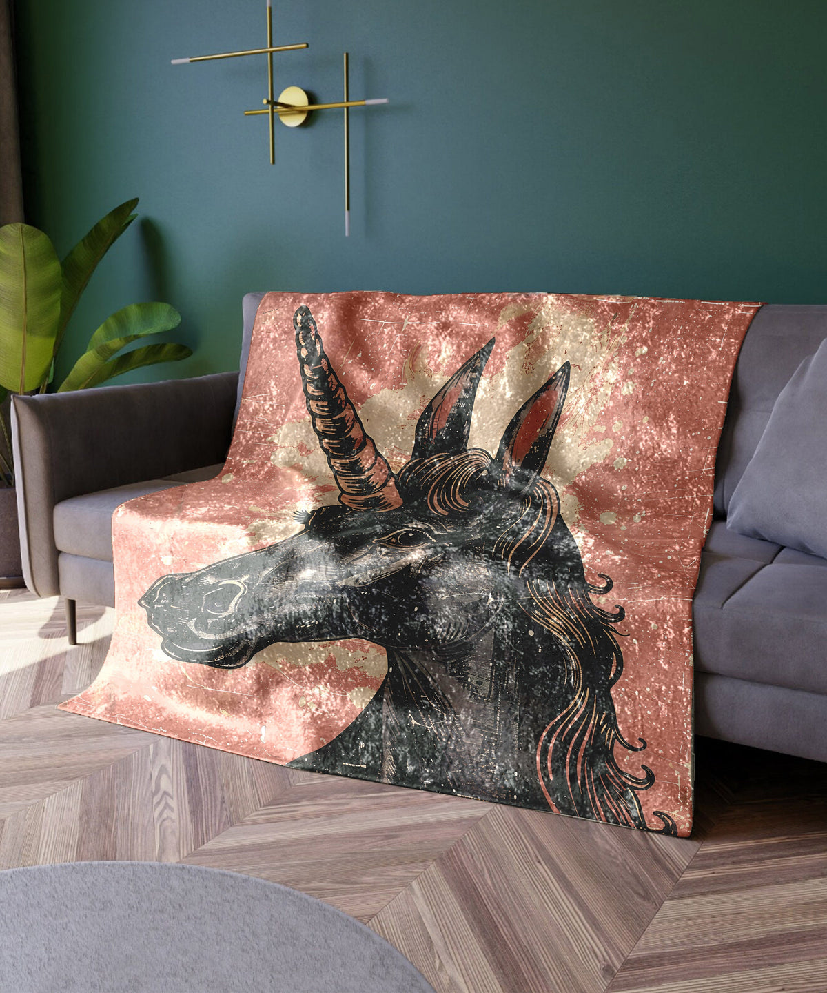 a couch with a blanket with a picture of a unicorn on it