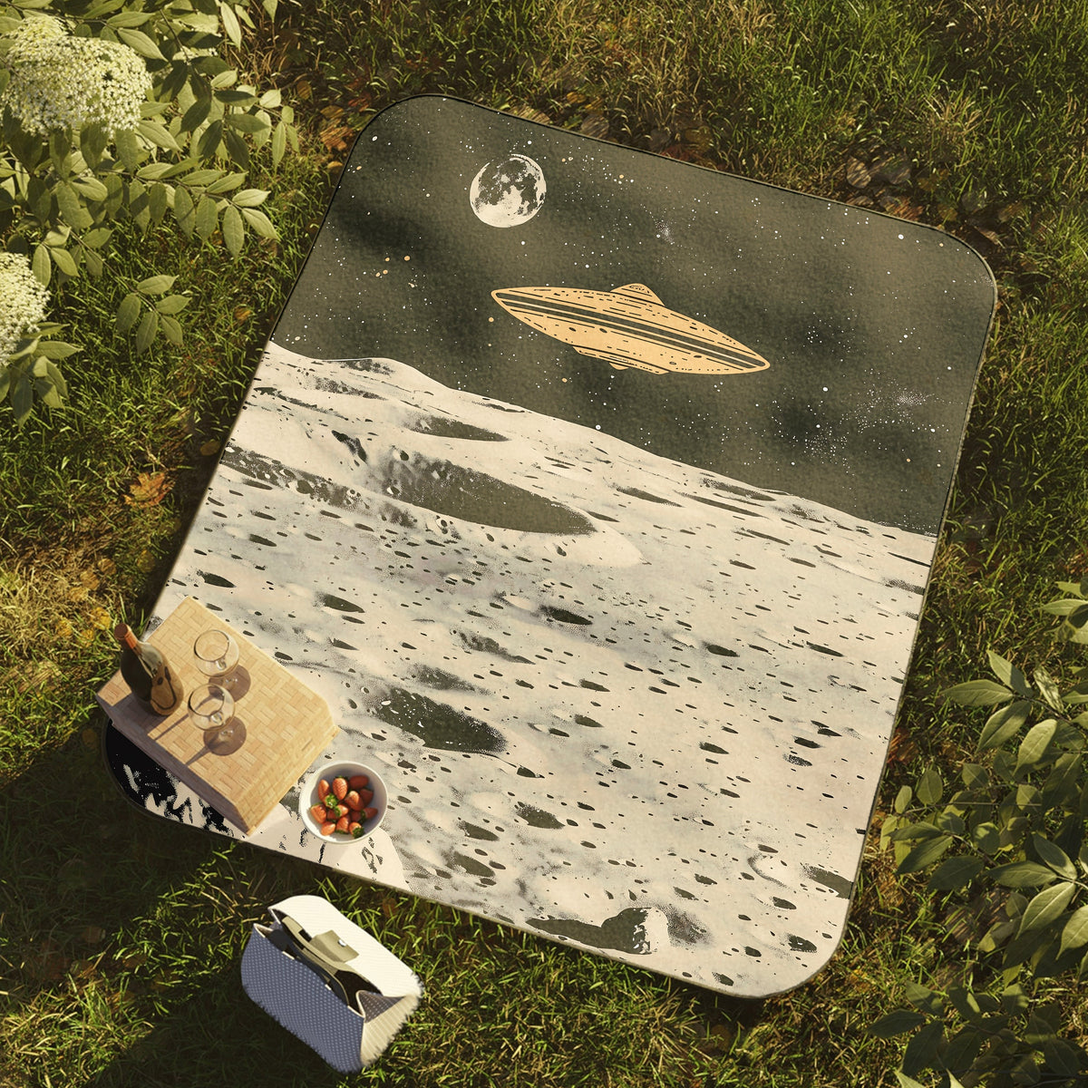 a picnic mat with a picture of a space ship on it