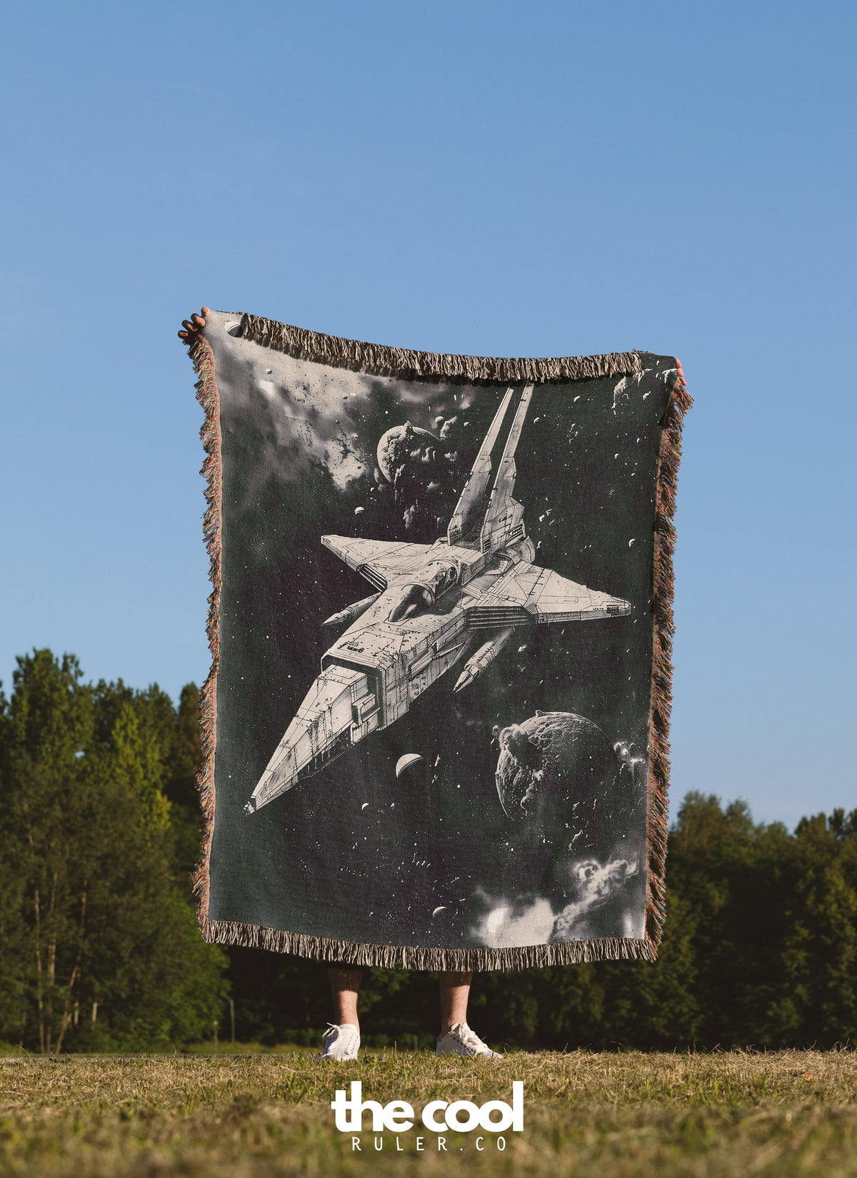 a person holding up a large poster of a fighter jet