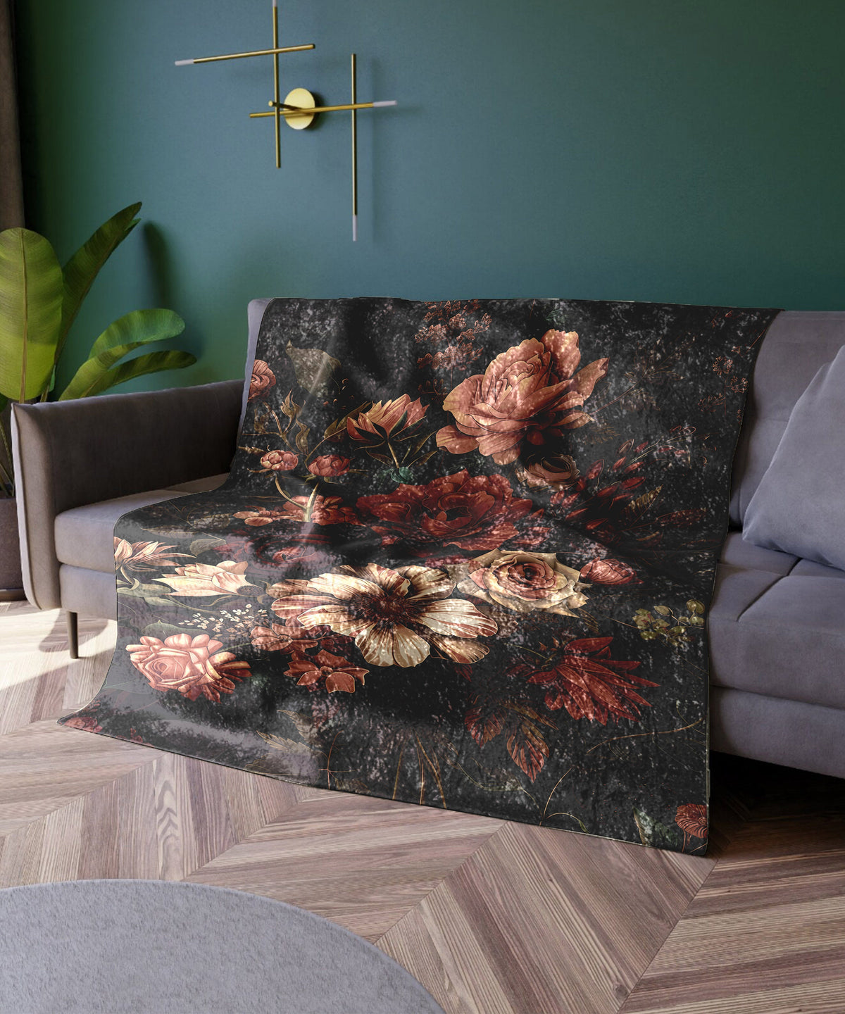 a living room with a couch covered in a floral blanket