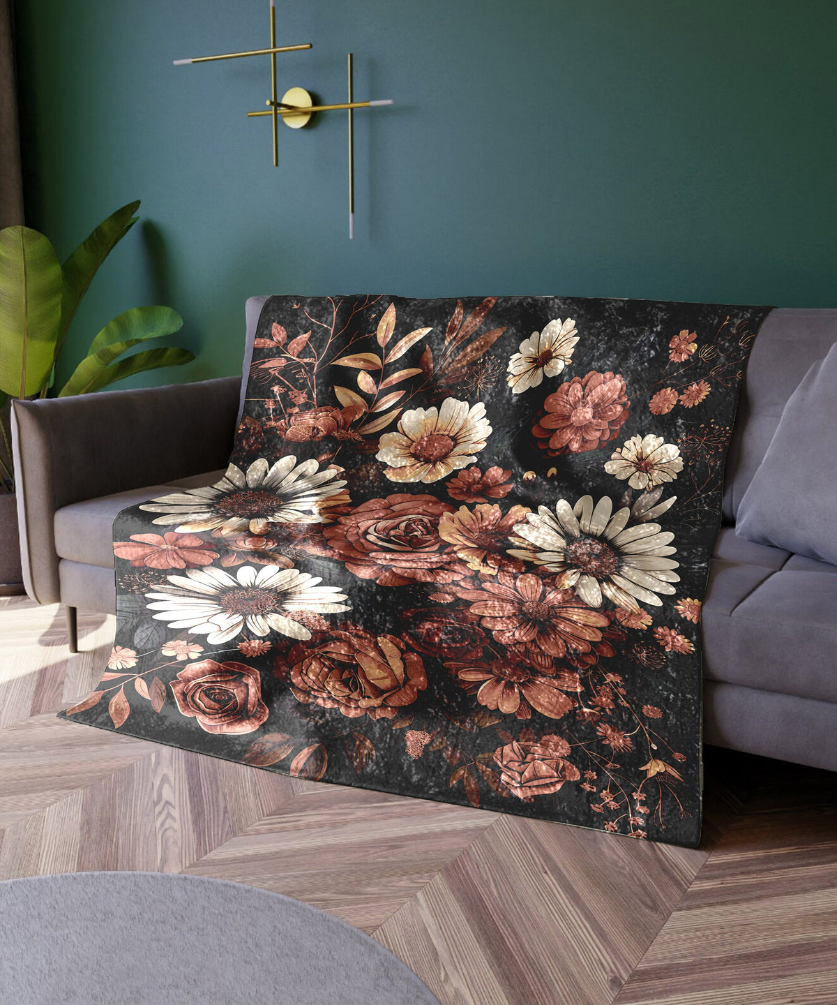 a living room with a couch covered in a floral blanket