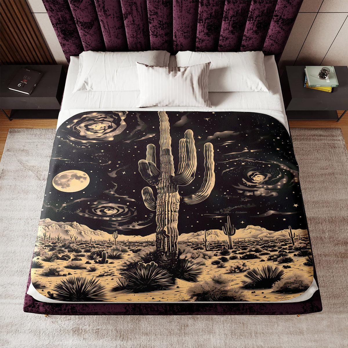 a bed covered in a blanket with a picture of a cactus on it