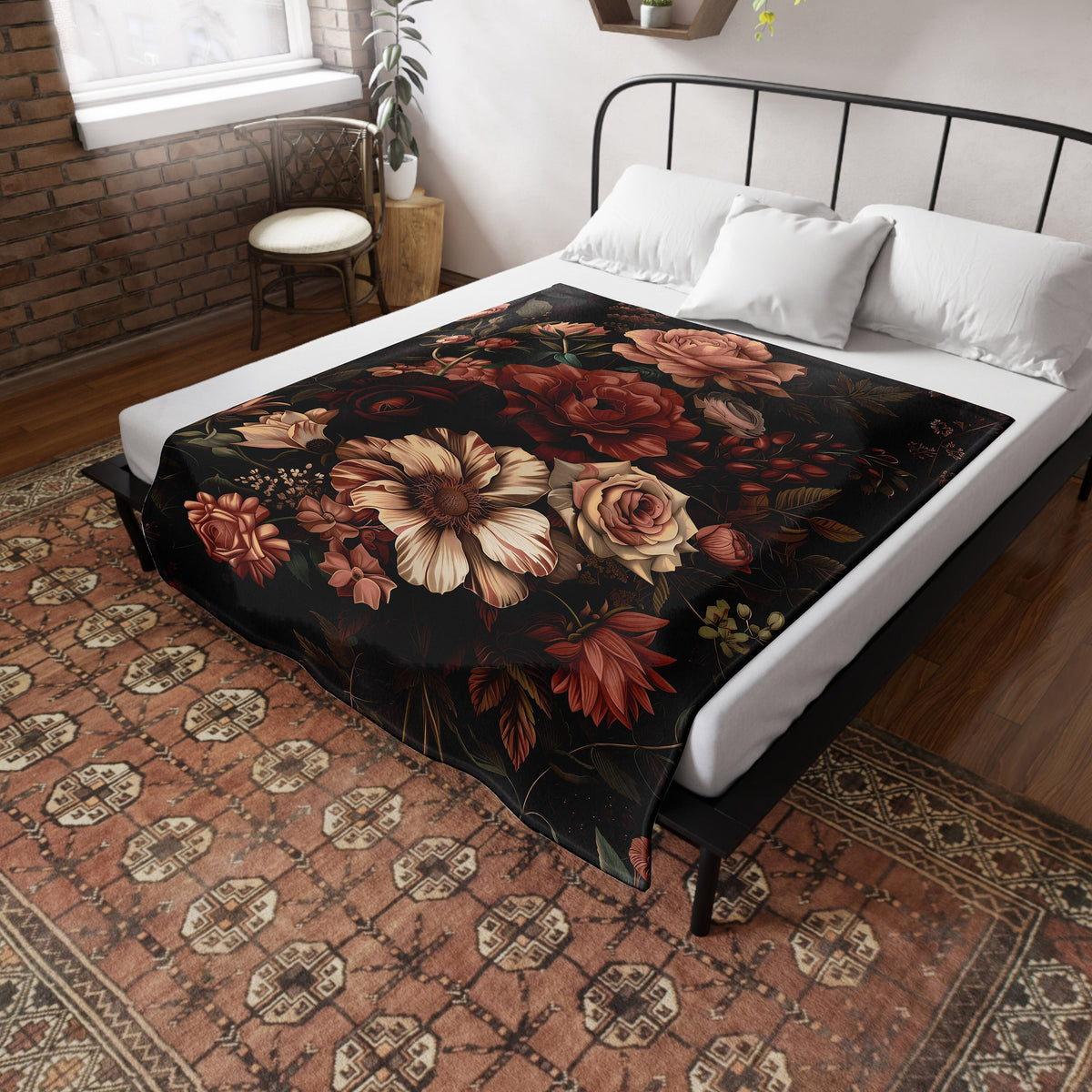 a bed with a floral comforter on top of it