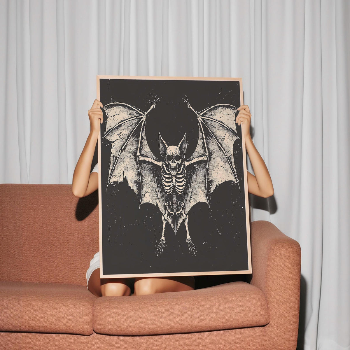 a woman holding up a picture of a bat
