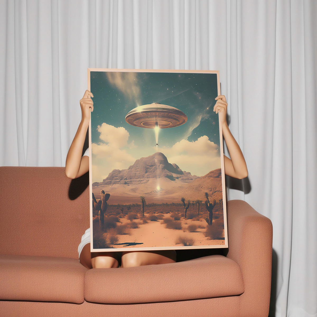 a woman holding up a picture of a flying saucer