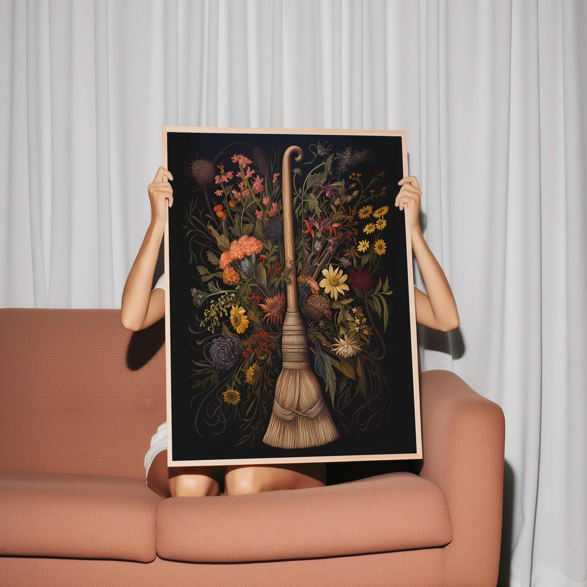 a woman holding up a picture of a vase with flowers