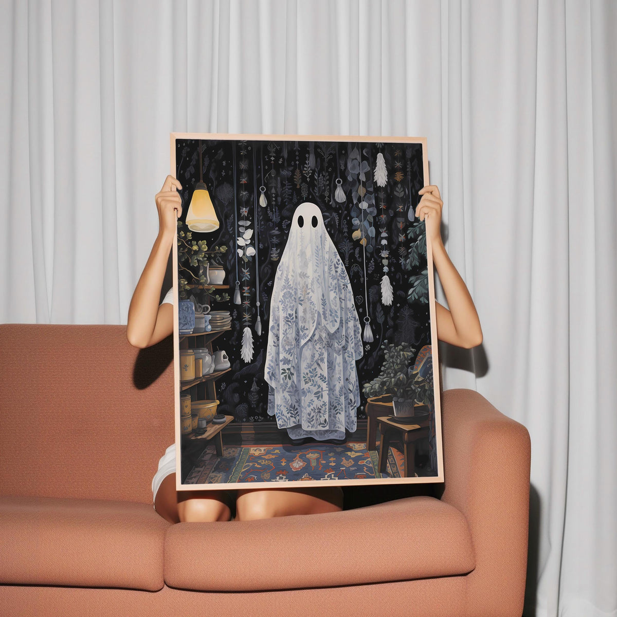 a woman holding up a picture of a ghost