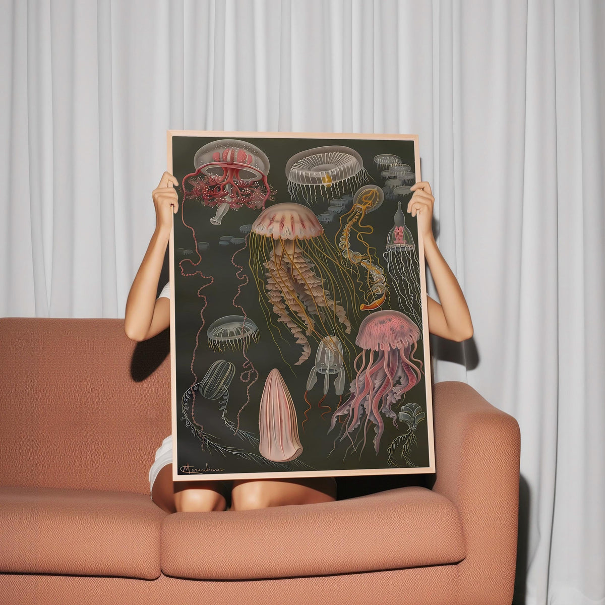 a woman holding up a picture of jellyfish
