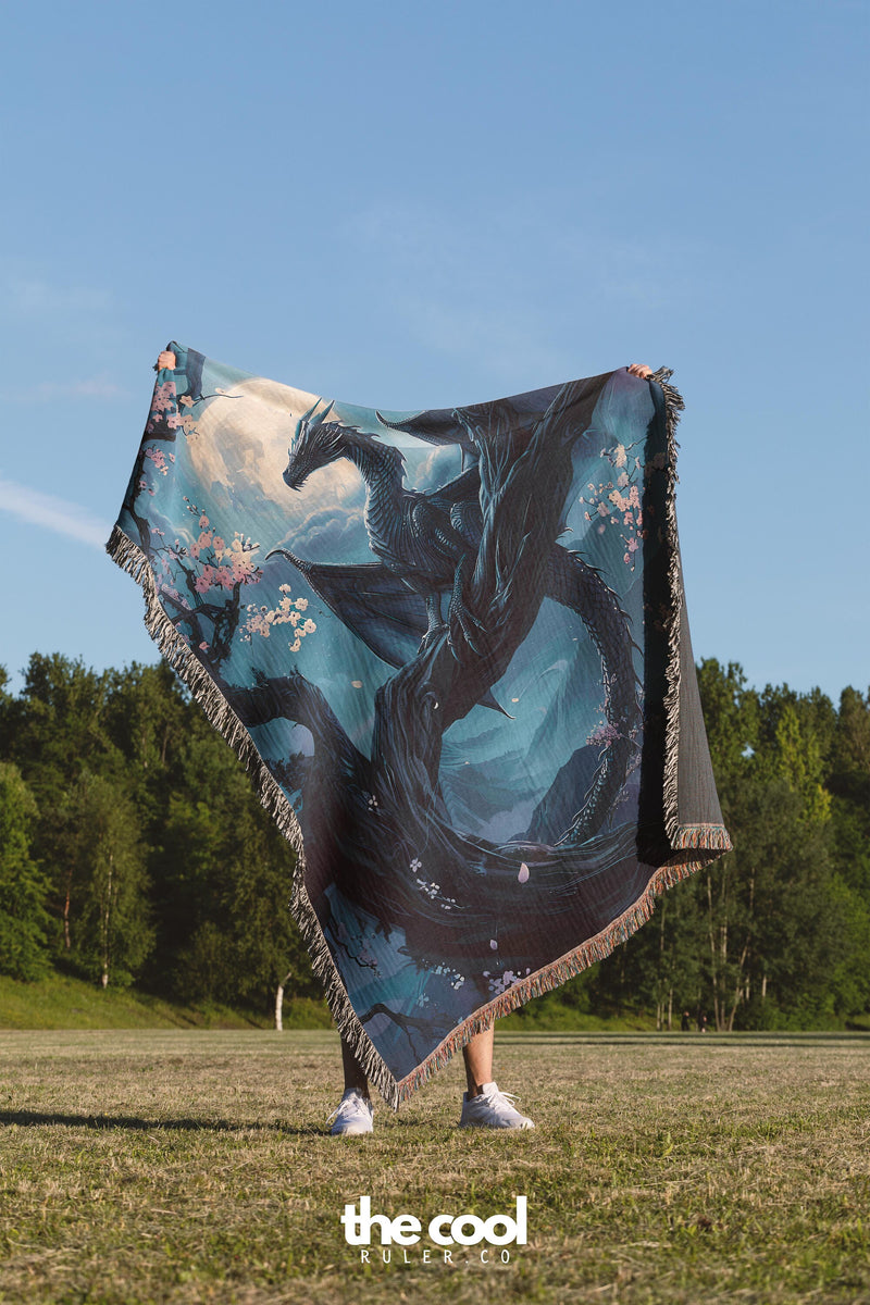 a person standing in a field holding a blanket