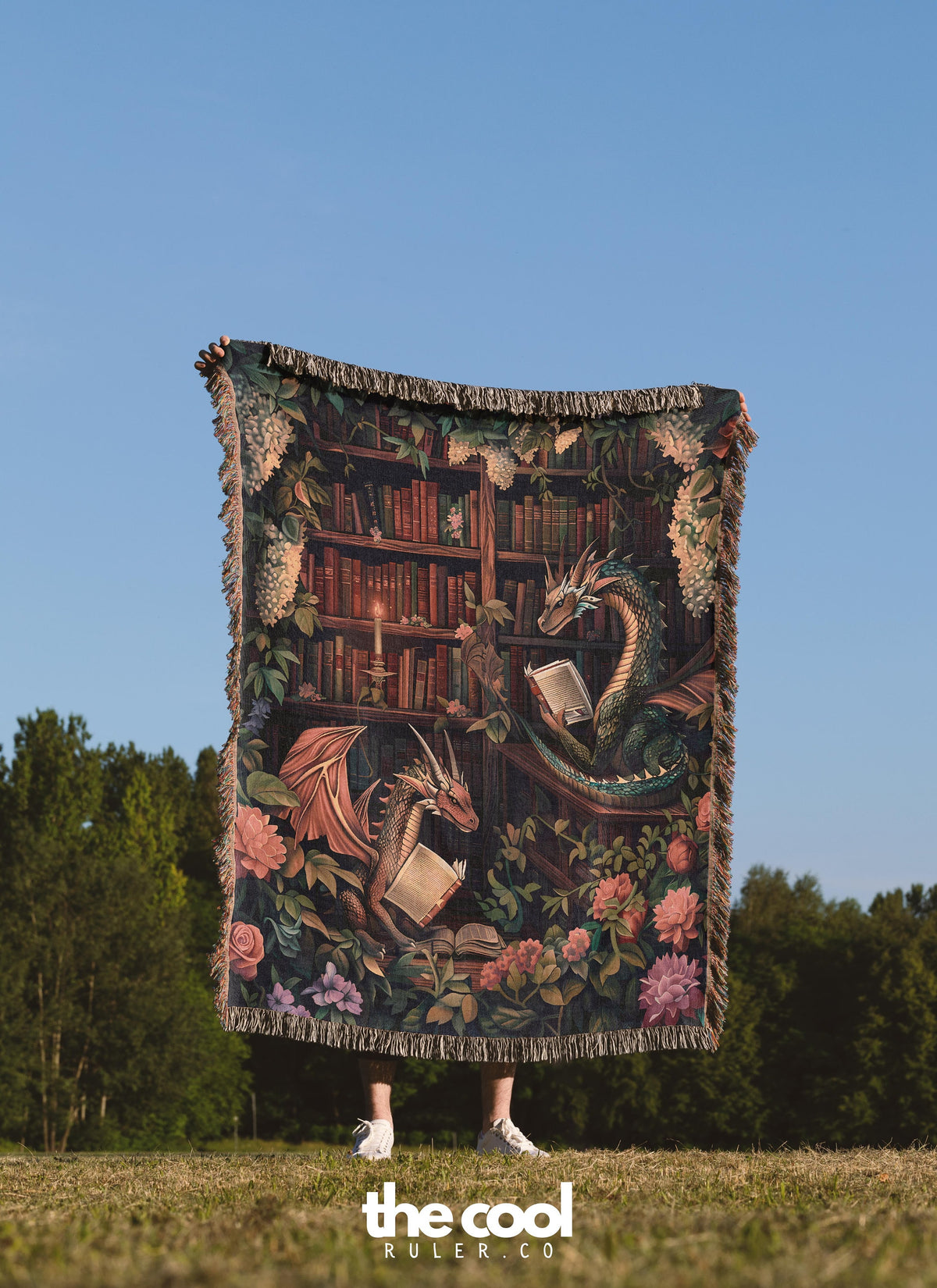 a woman standing in a field holding a tapestry