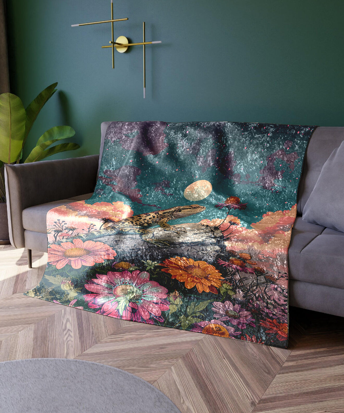 a living room with a couch and a flowered blanket