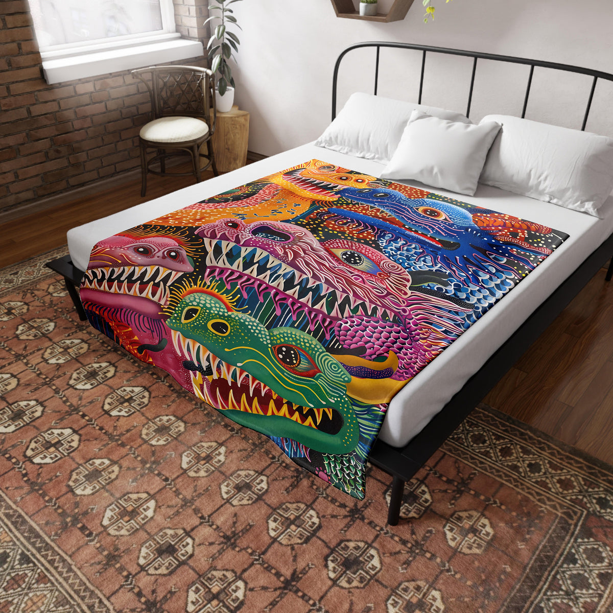 a bed with a colorful comforter on top of it