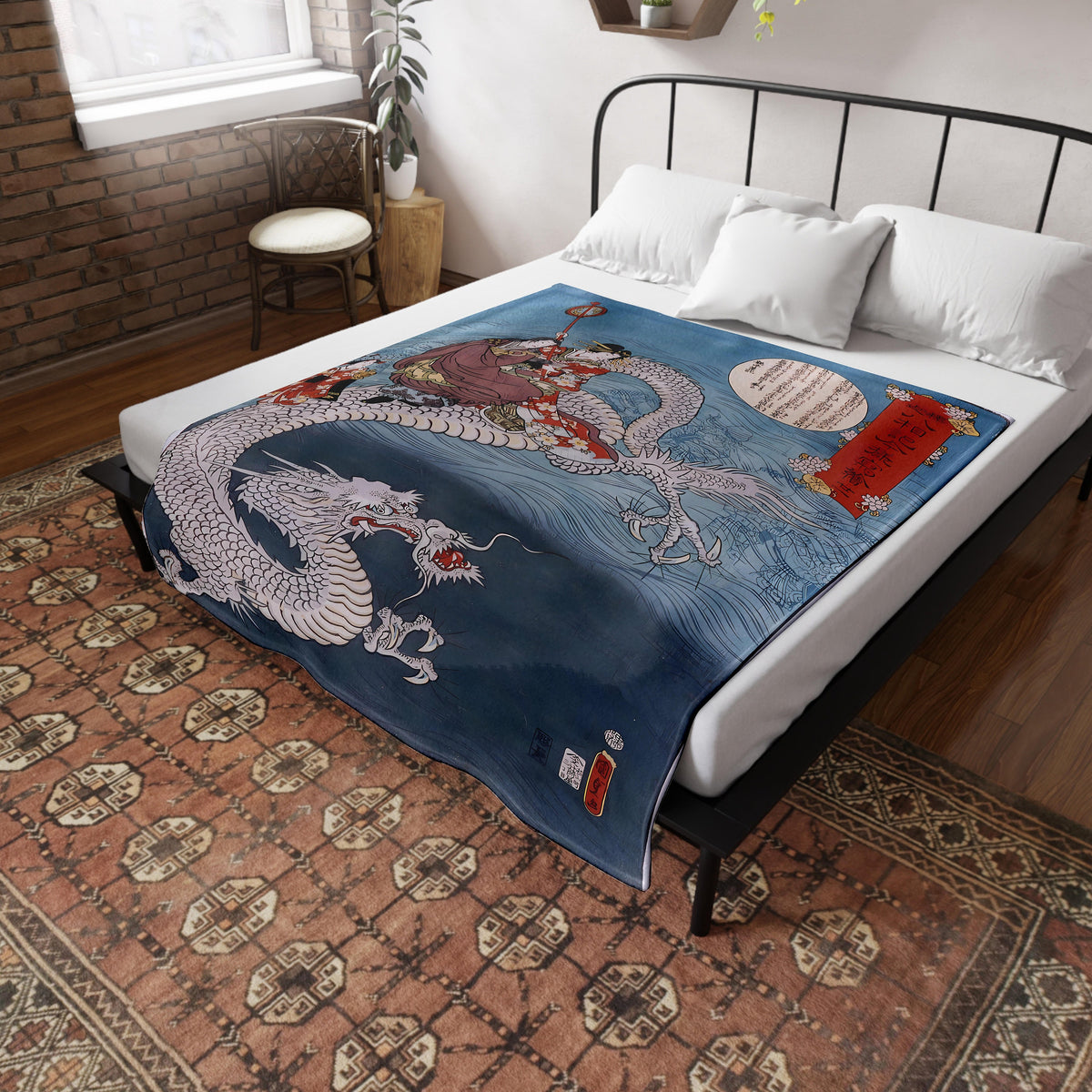 a bed with a dragon blanket on top of it