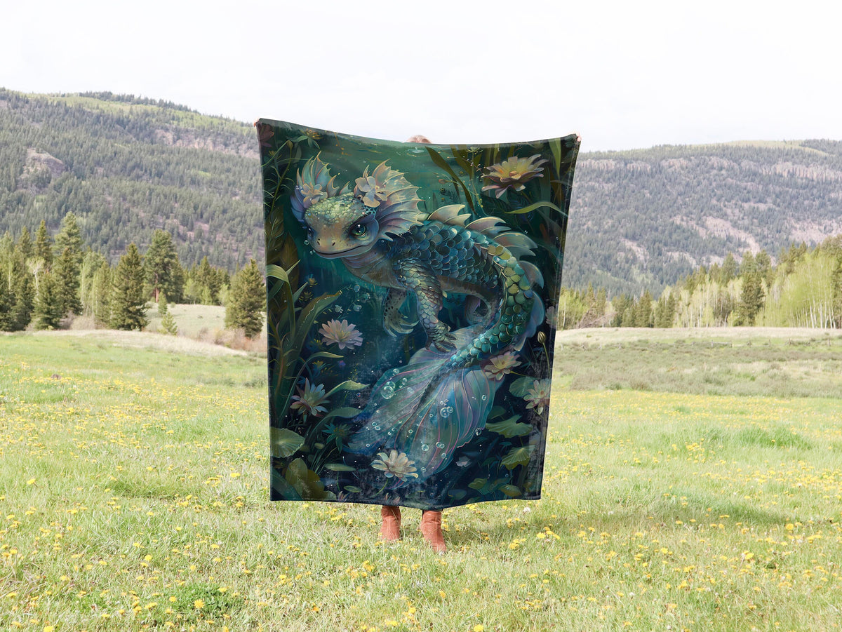 a woman standing in a field holding a blanket