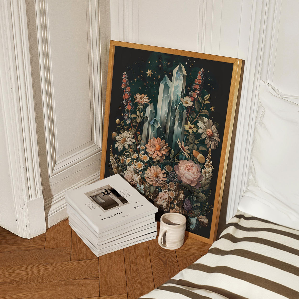 a stack of books sitting next to a painting