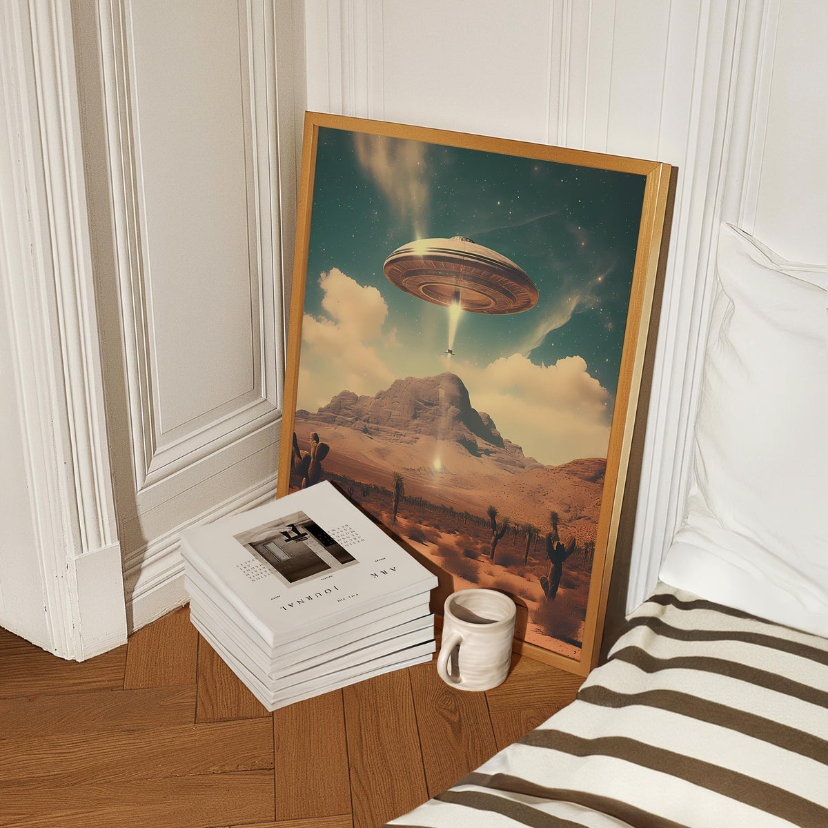 a stack of books sitting next to a picture of a flying saucer