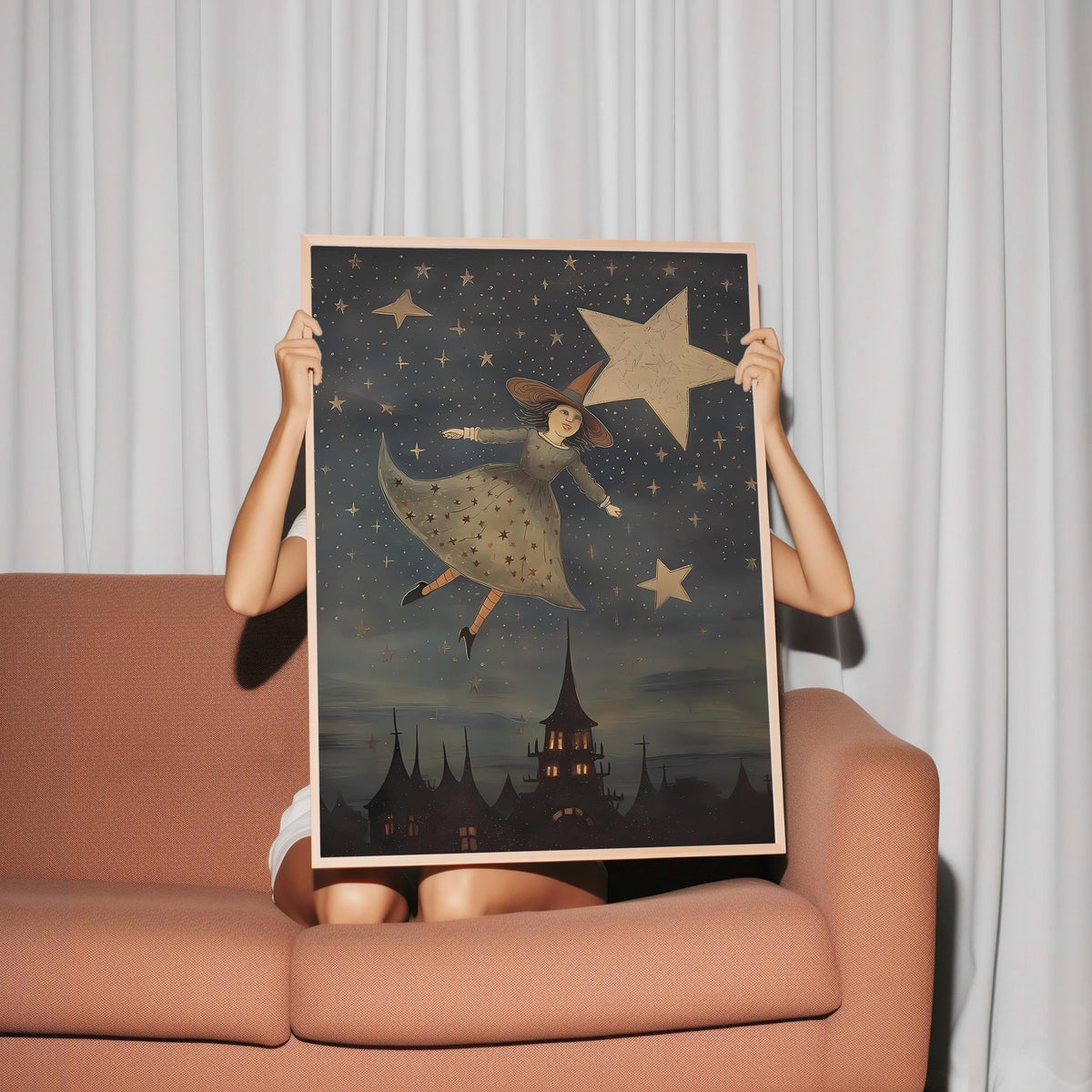 a woman is holding up a picture of a girl with stars