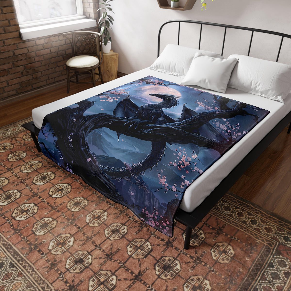 a bed with a dragon comforter on top of it