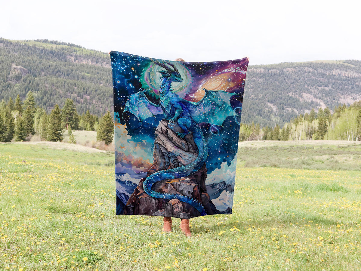 a woman is holding up a blanket in a field