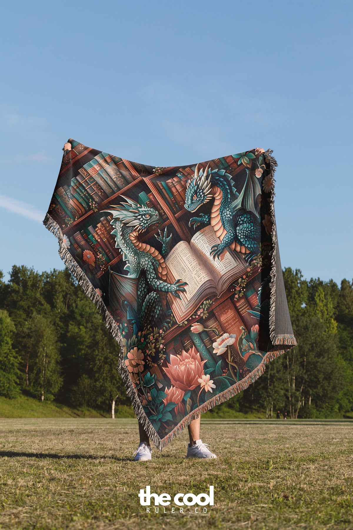 a person standing in a field holding a blanket