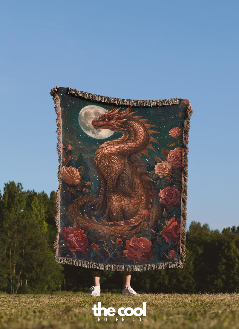 a woman holding a tapestry with a dragon on it